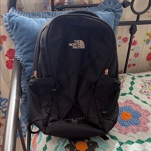 The North Face Black Backpack with Rose Gold Accents